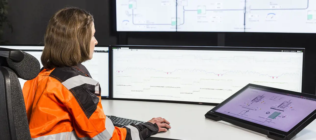 A data analyst optimizes processes by using a distributed control system
